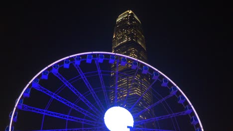 iluminación nocturna china ciudad de hong kong famosa rueda de ferris panorama 4k