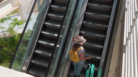 solo woman using airport stairs