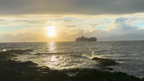 Large-cruise-ship-off-the-coast-of-Hawaii's-Big-Island-at-sunset