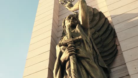 Protector-angel-bronze-statue-of-monument-in-Flag-Square,-Santo-Domingo