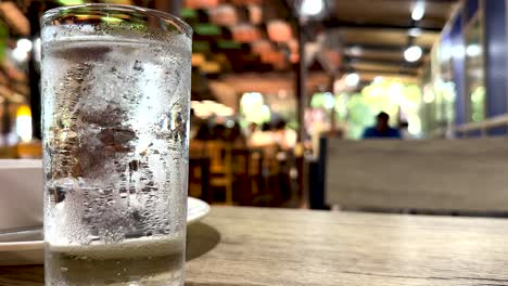 iced drinks on table in bustling restaurant