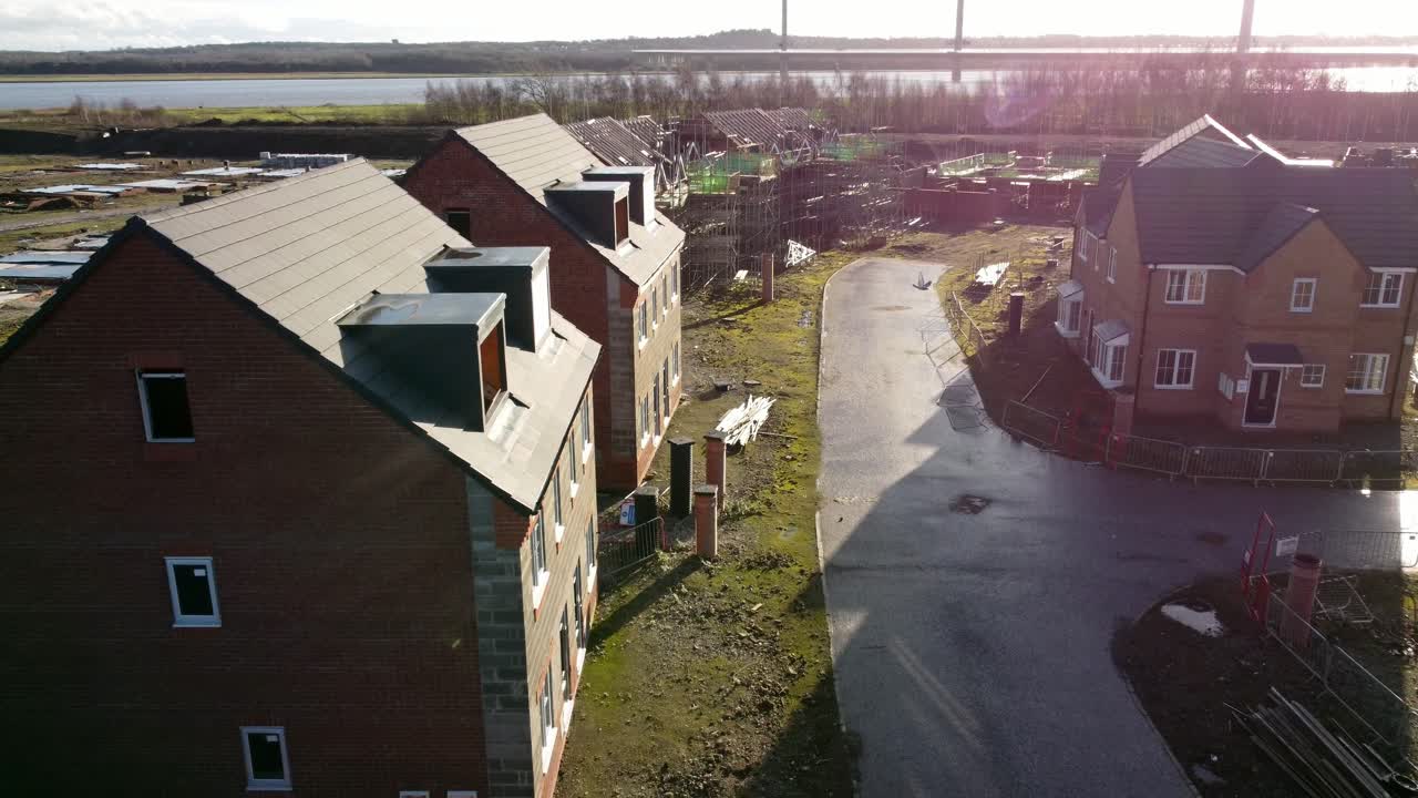 Unfinished waterfront residential property development construction site aerial view