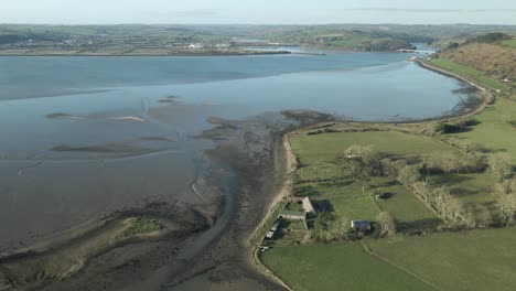 Blackwater-river-meeting-celtic-sea,-county-cork-ireland,-on-a-clear-day,-aerial-view