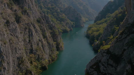 flying between cliffs in matka canyon in macedonia on a sunny day