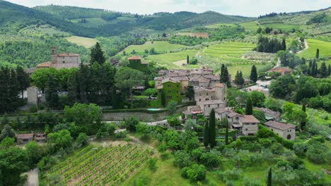 stunning drone footage of montefioralle, a charming medieval village in italy, showcasing its rustic architecture and surrounding lush countryside in natural light