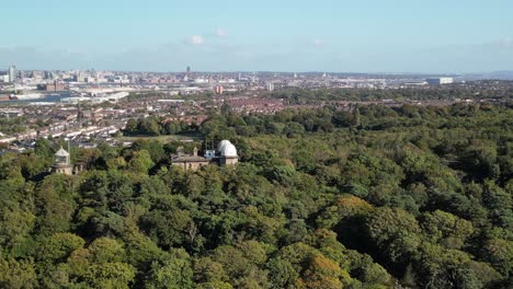 bidston observatory aerial drone parallax pan - liverpool city backdrop
