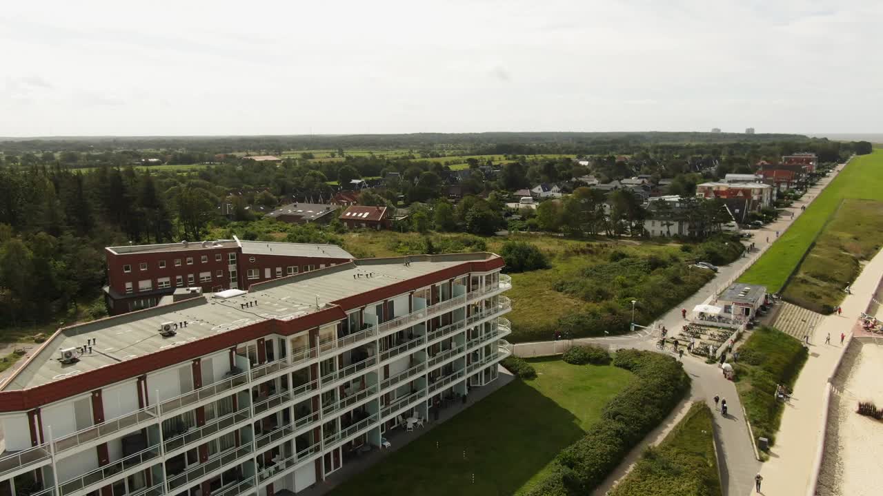 "A drone flight over a cozy hotel complex on the German North Sea coast