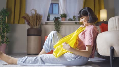 woman trying on clothes at home.