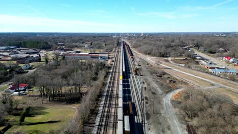 long train track reverse aerial in winter time at north carolina transportation museum