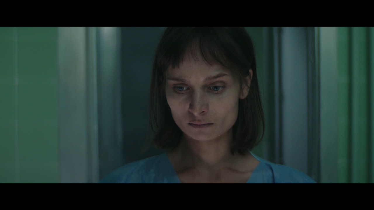 A girl runs through strange corridors of abandoned hospital