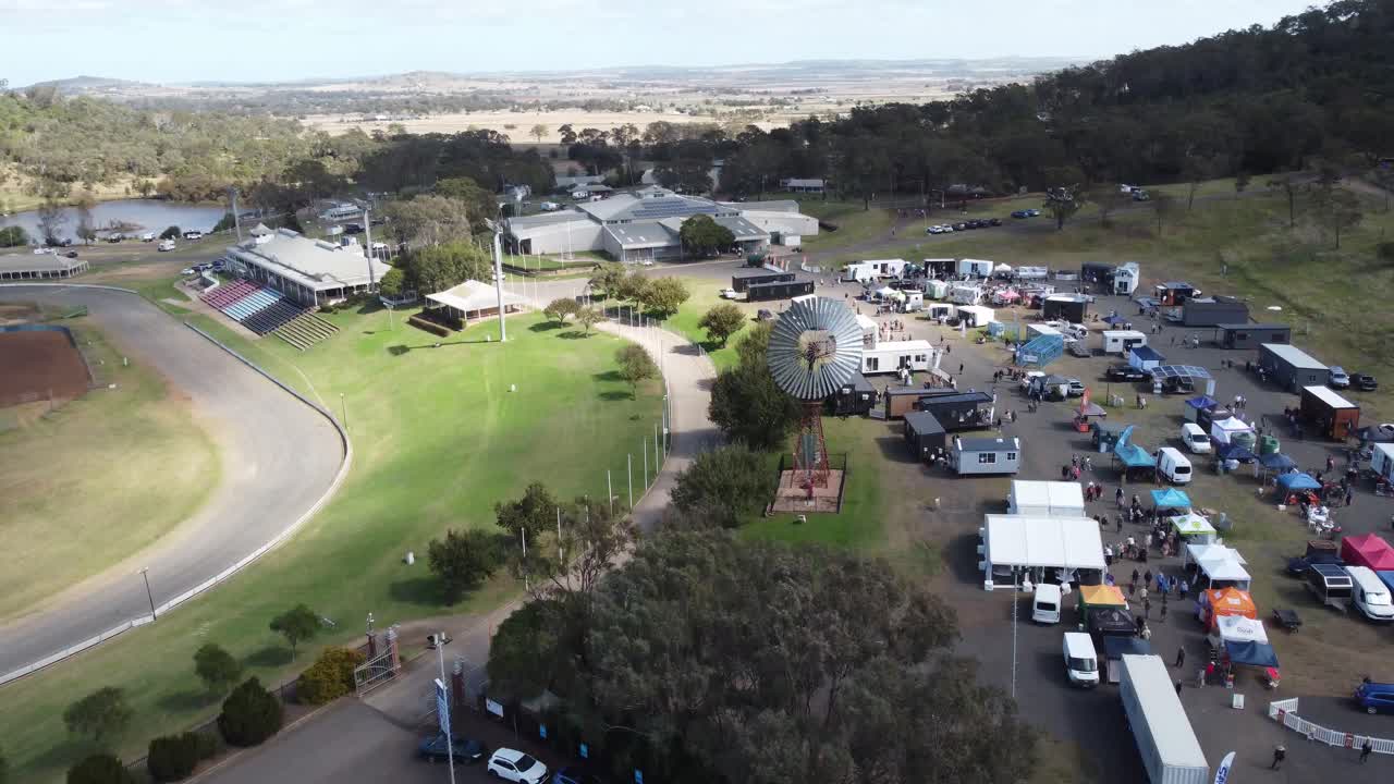 4K aerial view of a Showgrounds with a Tiny Homes Expo being held in a regional town in Australia