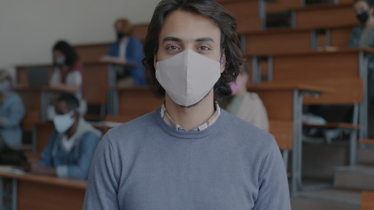 Student in a classroom wearing a mask