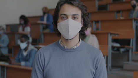 student in a classroom wearing a mask