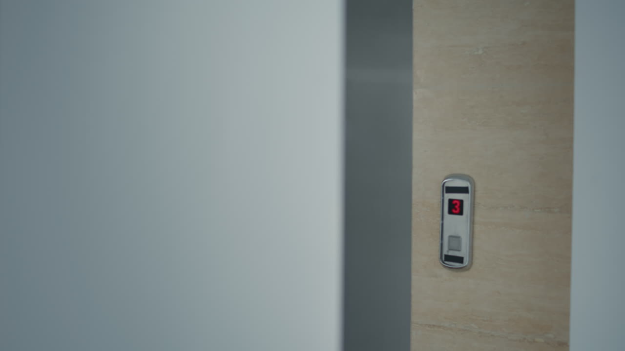 Businessman leaving office but starting to run when creepy brain-eating zombies come out of elevator
