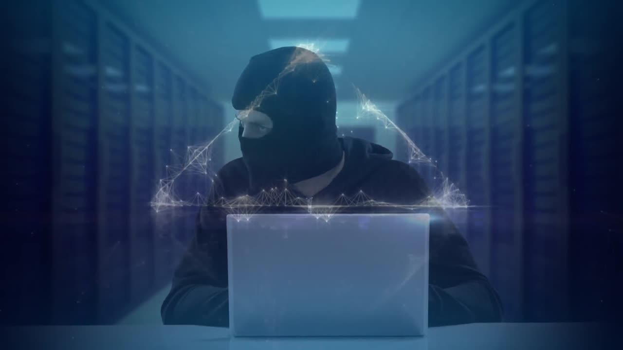 Animation of triangle over hacker with laptop and computer servers