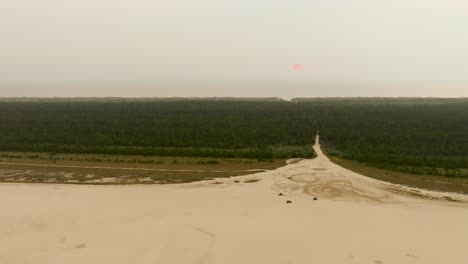 drone shot of atvs zipping through the sand in the florence, oregon dunes near jessie m