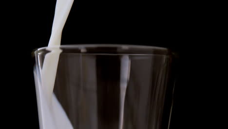 milk pouring into a glass