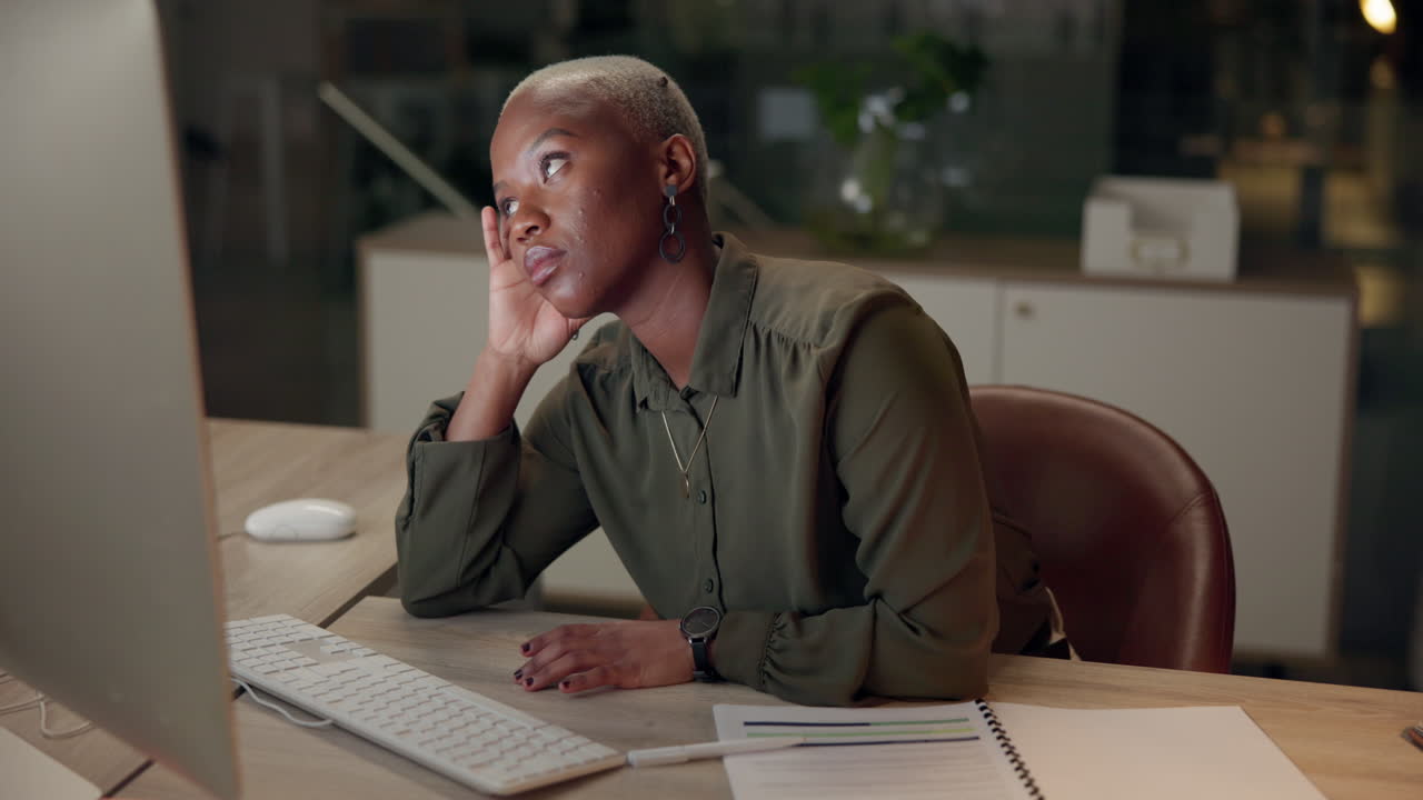 Tired woman working late at the office