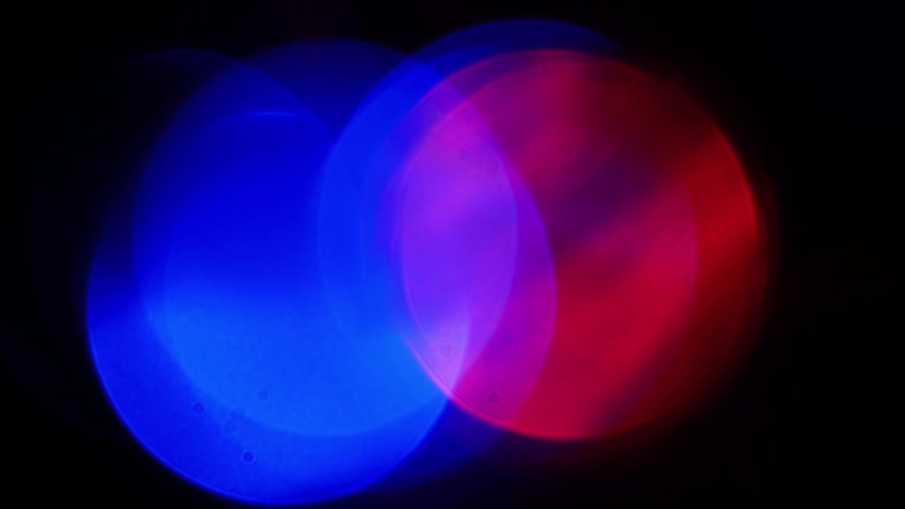 Red, blue and green round lights glow and blink
