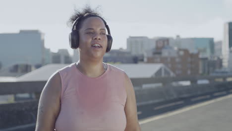 Plus-size-woman-listening-to-music-with-wireless
