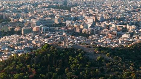 tight circling aerial shot of the philopappos monumentathens