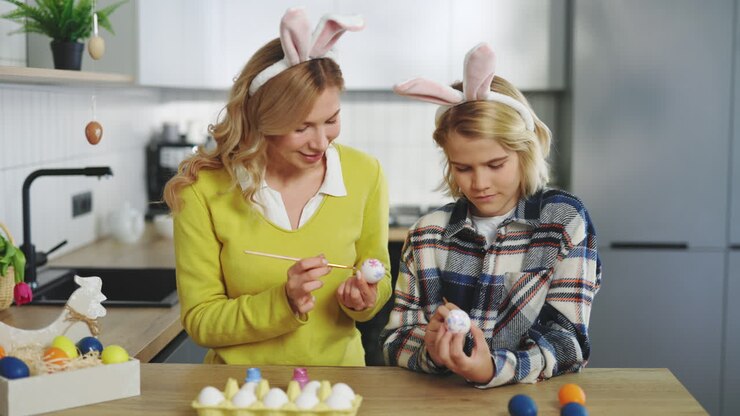Mom and Daughter Painting Easter Eggs