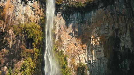 beautiful big rock wall waterfall in located in urubici, santa catarina, brazil