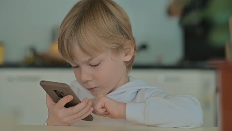 Child-With-Phone-Using-Apps-At-Home-1