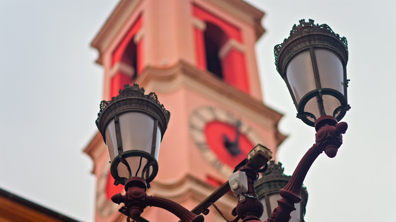 Close up of a street lamp with a blurred view buildings in Nice, France