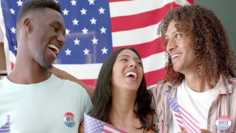 diverse friends wearing vote badges with american flags