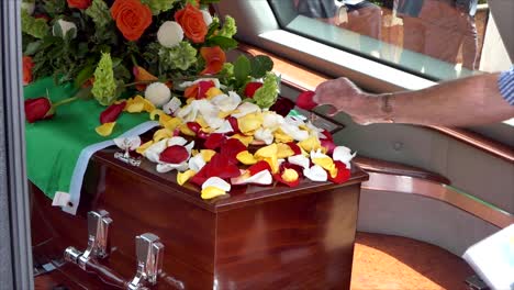 closeup-shot-of-a-funeral-casket-in-a-hearse-or-chapel-or-burial-at-cemetery