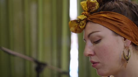 close-up profile of a woman wearing a headscarf