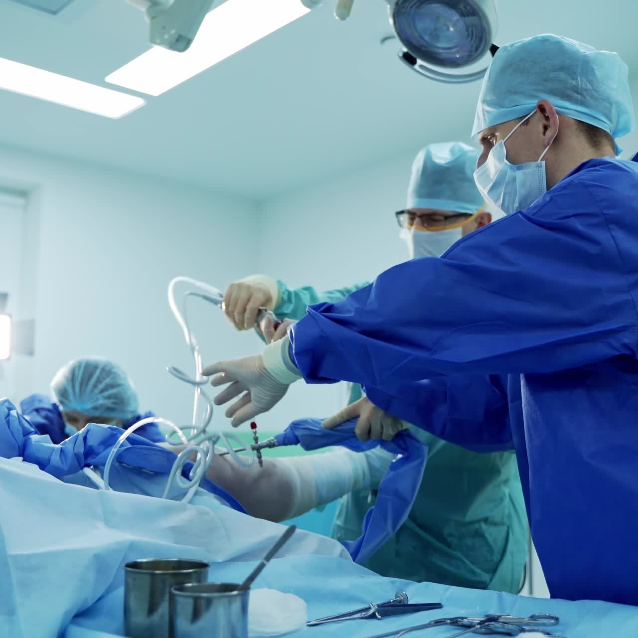 Surgery emergency treatment. Team of surgeons working together in operating room