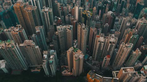 cinematic drone shot of a city with a lot of skyscrapers during the day