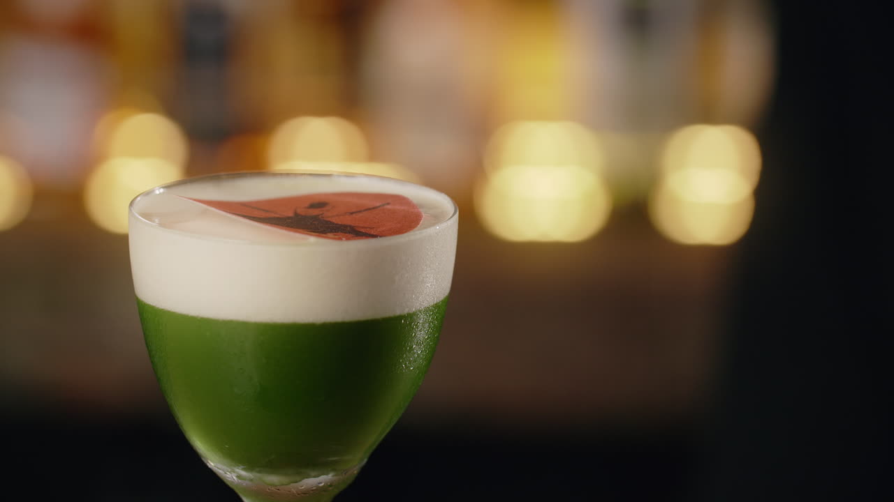 Stylish Green Cocktail with Foam and Design