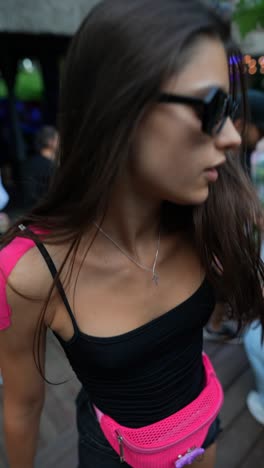 young woman dancing at an outdoor party