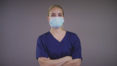 young blonde female doctor wearing face mask