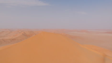 highest dune in the empty quarters, oman, showing vast desert landscape during summer