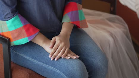 young latina woman dressed in traditional honduran blouse made with lenca fabric