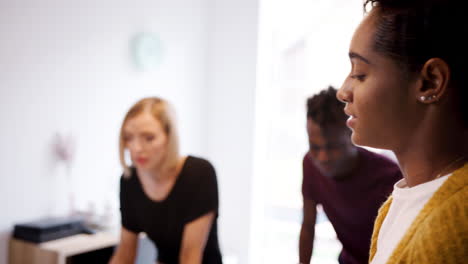 young creative business team brainstorming in a meeting room, rack focus