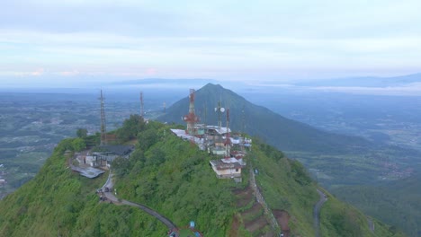 Aerial-view-of-telecommunications-tower-on-a-mountain-peak