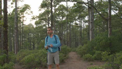 male traveler reading map