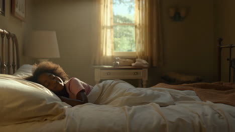 a young girl sleeping and waking up in bed