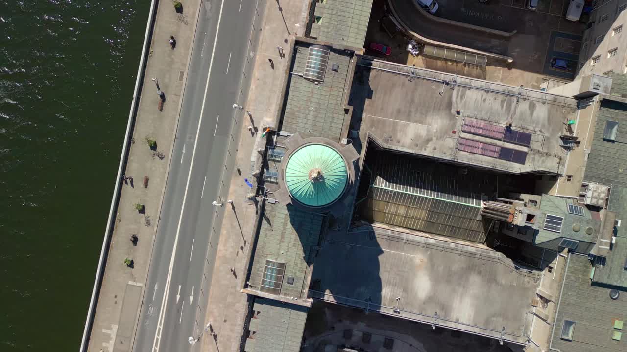 Overhead rising aerial video of Custom House Quay in Dublin, County Leinster, Ireland on a bright and sunny day. Filmed in 4K, 60FPS and with Rec709 color.