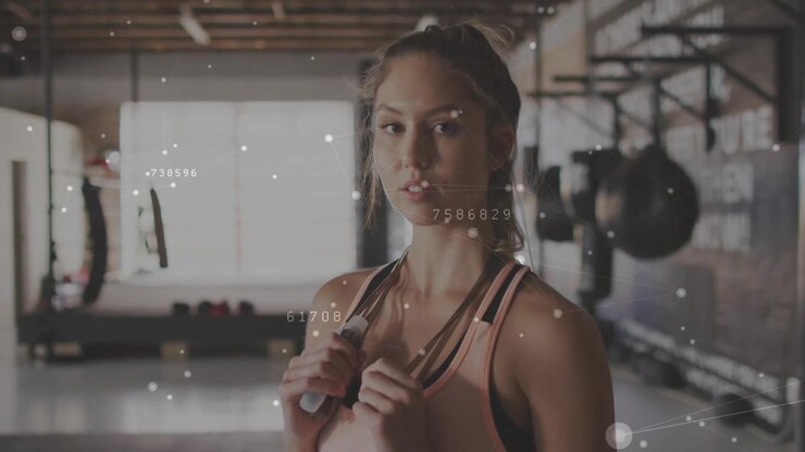 Woman holding jump rope in fitness gym overlay drifting and causing subtle rotations preparing demo