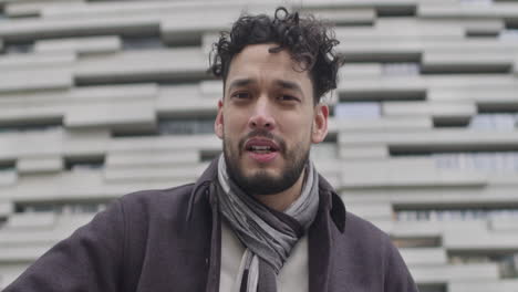handsome hispanic ethnicity male talk on camera, positively happily