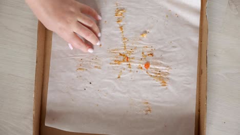 man grabs last pizza slice and leaves empty delivery box