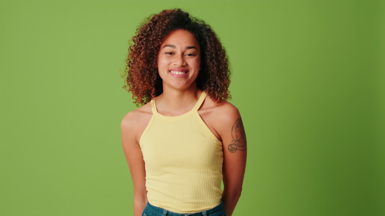 Young African American Woman Smiling on Green Screen