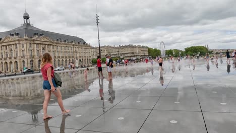 people enjoying reflections at place de la bourse