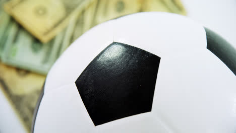 football and dollar on white background 4k